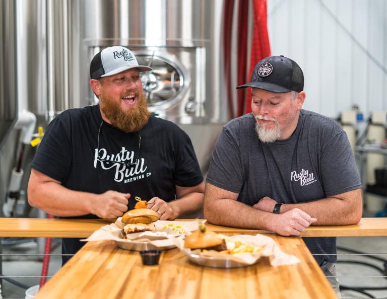 Ben and Brian, owners of Rusty Bull Brewing, welcome you